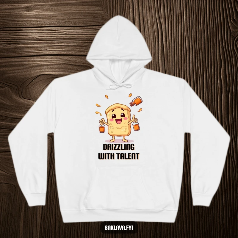 Funny baklava character juggling syrup bottles with glee, featured on a warm hoodie. Humorous and cozy apparel for dessert aficionados.